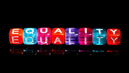 inscription word equality in multicolored cubes isolated on dark background. concept of equality. inscription in colorful blocks. symbols and illustrations for celebrations such as international women