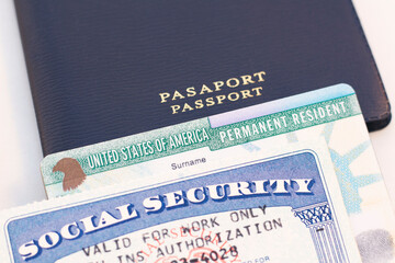United States passport, social security card and permanent resident (green) card on white background. Immigration concept	 - obrazy, fototapety, plakaty