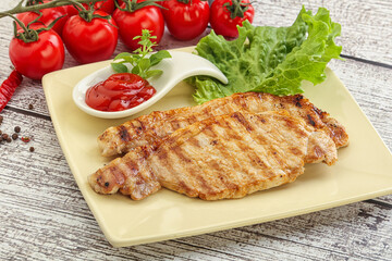 Grilled pork steak with ketchup