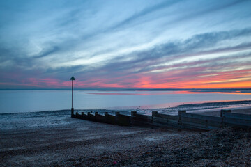 Fototapeta na wymiar Winter sunset on Chalkwell beach, Essex, England, United Kingdom