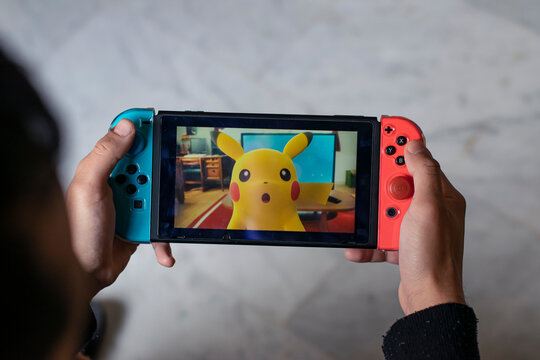 Granada, March 5, 2023: Nintendo Swich video console with Pokemon game
