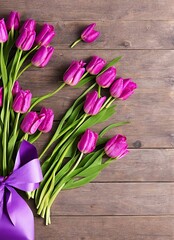 beautiful bouquet of pink tulips on wooden background