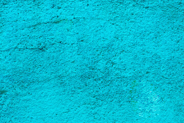 Abstract texture of blue old cracked stucco. High quality photo . Wall with old turquoise plaster close-up.