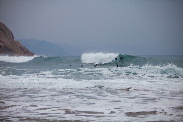 Waves in the ocean crash against the rocks