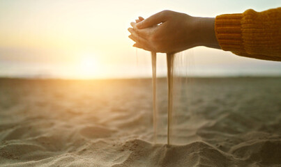 Sand slips through your fingers. Time is fleeting.