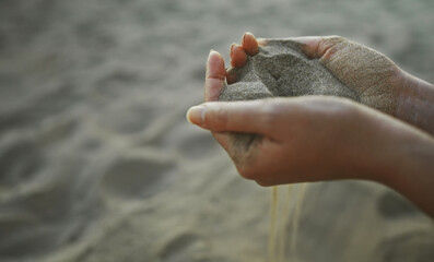 Sand slips through your fingers. Time is fleeting.
