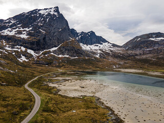 Aerial footage of Lofoten, Norway, during a sunny day with clouds