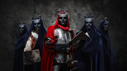 Portrait of occult brotherhood and their leader with book against dark background.