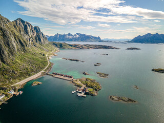 Aerial footage of Svolvaer in Lofoten, Norway, during a sunny spring day with few clouds and blue sky - obrazy, fototapety, plakaty