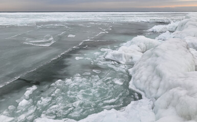 Coastal cliffs and coastal protection structures frozen with ice in the cold winter of 2010, the Black Sea