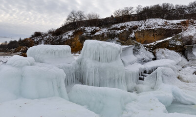 Coastal cliffs and coastal protection structures frozen with ice in the cold winter of 2010, the Black Sea
