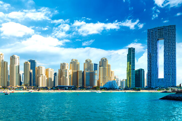 Fototapeta na wymiar View of the Persian Gulf's golden sand beaches at sunset, including the JBR and Dubai Marina areas. Vacations and holidays in the UAE