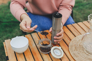 Drip coffee on vacation outdoor and drinking a cup of hand coffee in autumn morning. relax and enjoy outdoor lifestyle and holiday travel vacation.