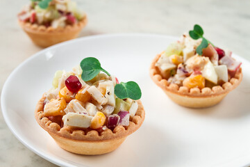 canapes with salad, corn with crab sticks, appetizer, portioned, close-up, no people,