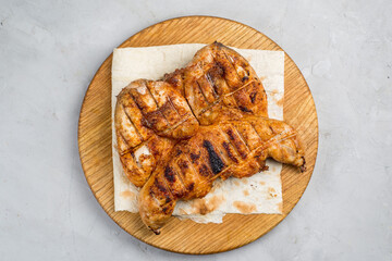 Grilled chicken on a cutting board