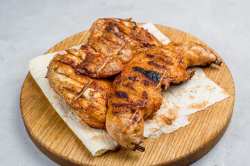 Grilled chicken on a cutting board