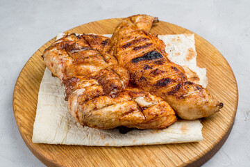 Grilled chicken on a cutting board