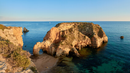 Small islet and grotto near Praia Joao de Arens in Alvor, Algarve region