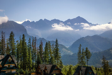Tatra Mountains panorama seen from Glodowka Glade (Polana Głodówka), Poland, Bukowina Tatrzańska in summer time. Gorgeous mountain ridge with high rocky peaks. Sunny early autumn day with soft clouds. © Anna