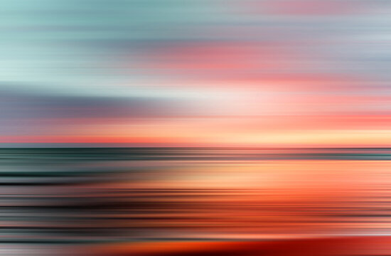 sunset colors on ocean horizon, motion blur