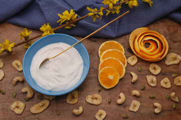 Bowl with Greek yogurt and fruit with nuts, seeds