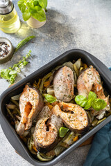 Seafood. Recipe. Healthy baked fish salmon steaks with basil, green beans, sweet peppers and onions. Cooking a delicious low carb dinner, healthy nutrition concept, diet menu. Copy space.