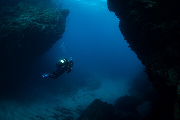 Female Scuba diver diving in the Canary Islands in Tenerife at Cala Amarilla
