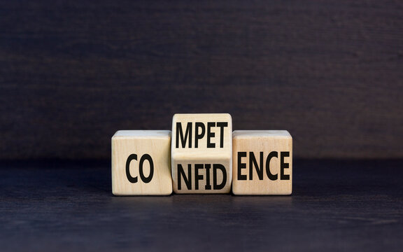 Competence and confidence symbol. Concept word Competence Confidence on wooden cubes. Beautiful black table black background. Business and competence and confidence concept. Copy space.