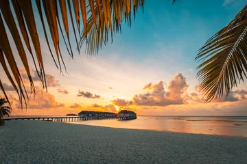 Papier Peint photo Bora Bora, Polynésie française Sunset on Maldives island, luxury water villas resort and wooden pier. Beautiful sky and clouds and beach background for summer vacation holiday and travel concept. Exotic destination scenic, freedom
