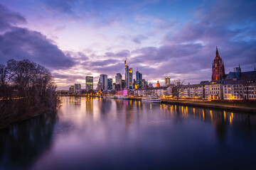 Fototapeta na wymiar Beautiful Frankfurt skyline with purple light - Frankfurt, Germany
