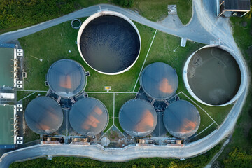 
Vertical view of the process components, fermenters and biogas storage tanks of the agricultural biogas plant. Use of biogas in cogeneration units for electricity and heat production. - obrazy, fototapety, plakaty