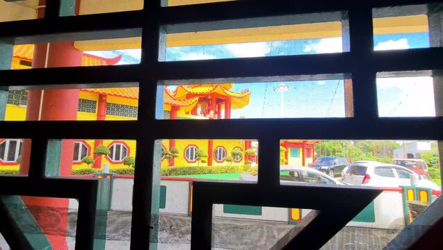 View of beautiful yellow temple from a window