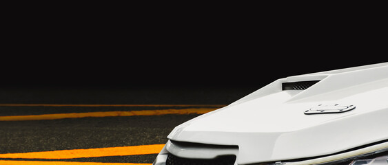 Close up of a air duct on car hood of turbo engine in a white sports car, panoramic banner with...