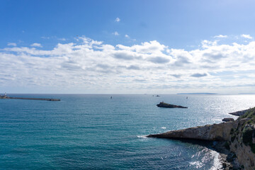 View of the sea and the coast from above the walls of the city of Ibiza on a sunny day.