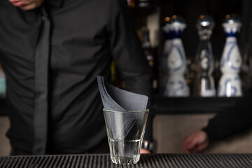 cocktail glass with napkins in a bar