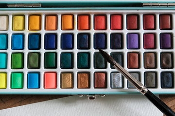 water color box top view with brush