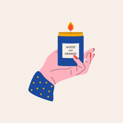 Hand holding candle. Cartoon scented wax candle in jar, aromatherapy relax concept. Modern vector flat illustration