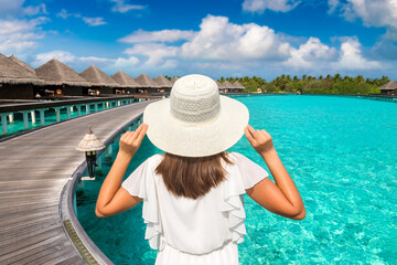 Woman standing on the wooden pier