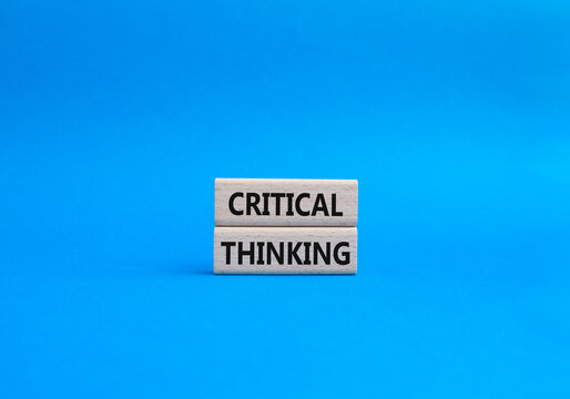 Critical thinking symbol. Wooden blocks with words Critical thinking. Beautiful blue background. Business and Critical thinking concept. Copy space.