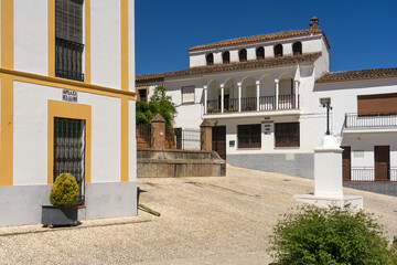 Fototapeta na wymiar Beautiful Square of Llano with its typical white facades in Almonaster La Real in Huelva province, Andalucia, Spain.