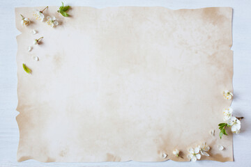 Wooden white background with spring flowers blooming cherry plum, paper with copy space, for text...