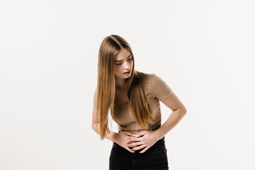 Stomach pain. Pancreatitis disease of pancreas becomes inflamed. Sick attractive girl hold abdomen because it hurts.