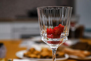 Frozen strawberry in a wine glass