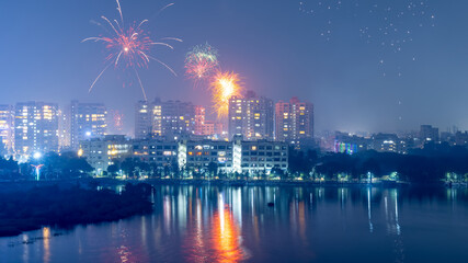 Hyderabad cityscape in Telangana, India. illuminated with Diwali festival fireworks. - obrazy, fototapety, plakaty