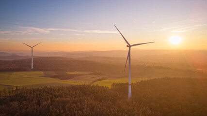 wind turbines in the countryside at sunset