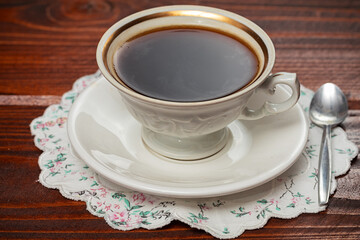 cup of coffee on wooden table.