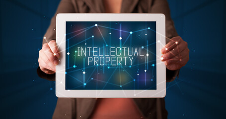Person holding tablet, security concept