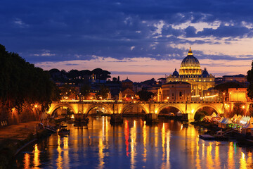 Night view of old Sant' Angelo Bridge  and St. Peter's cathedral in Vatican City Rome Italy. - 578132610