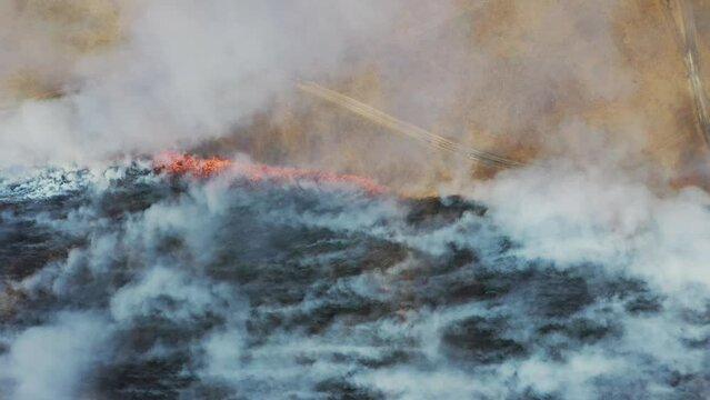 Burned Soil With Thick Smoke Above Hortobagy National Park Hungary Aerial view