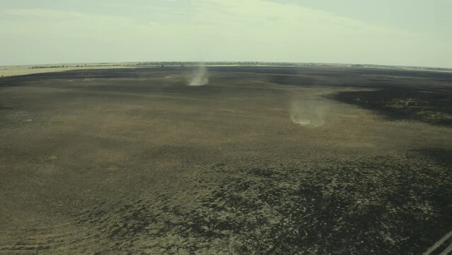 Aerial views of burning and scorched dry fields and whirlwinds. Hortobágy National Park Hungary